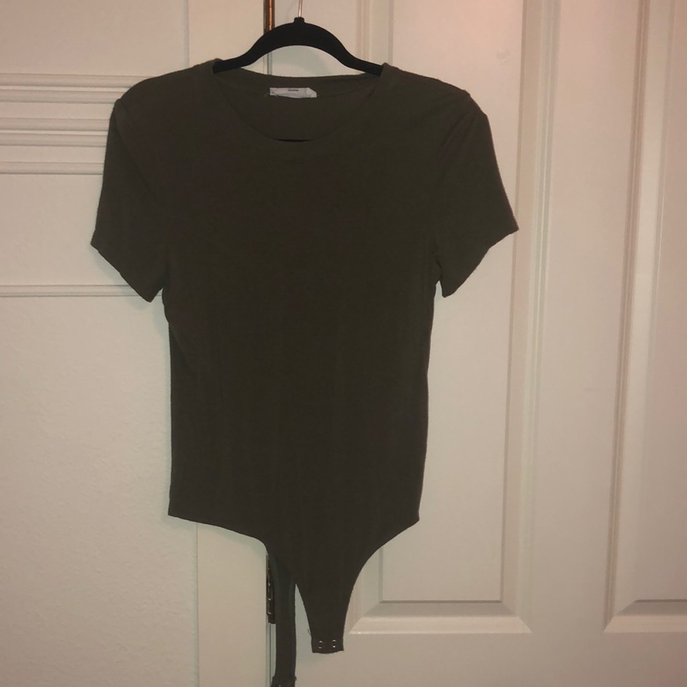 This body suit is an army green. It is a size small. Fits tightly. Size small.